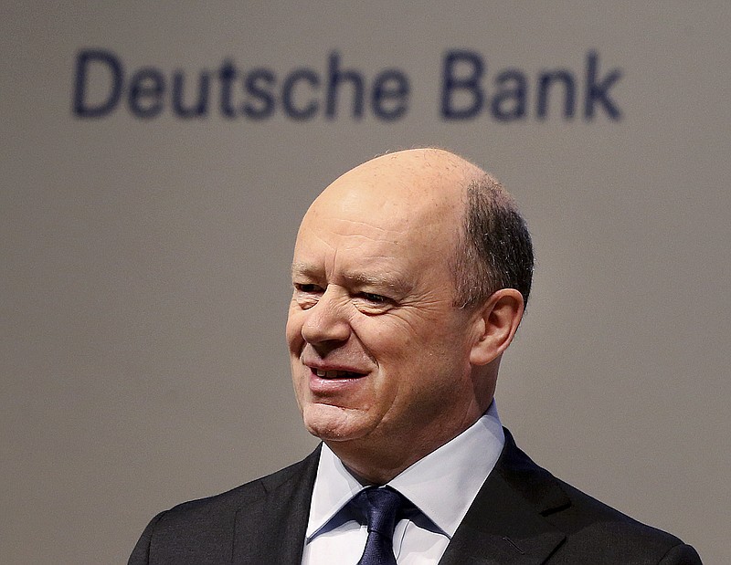 
              CEO of Deutsche Bank John Cryan poses for photographers at the beginningg of the bank's annual shareholders meeting in Frankfurt, Germany, Thursday, May 18, 2017. (AP Photo/Michael Probst)
            