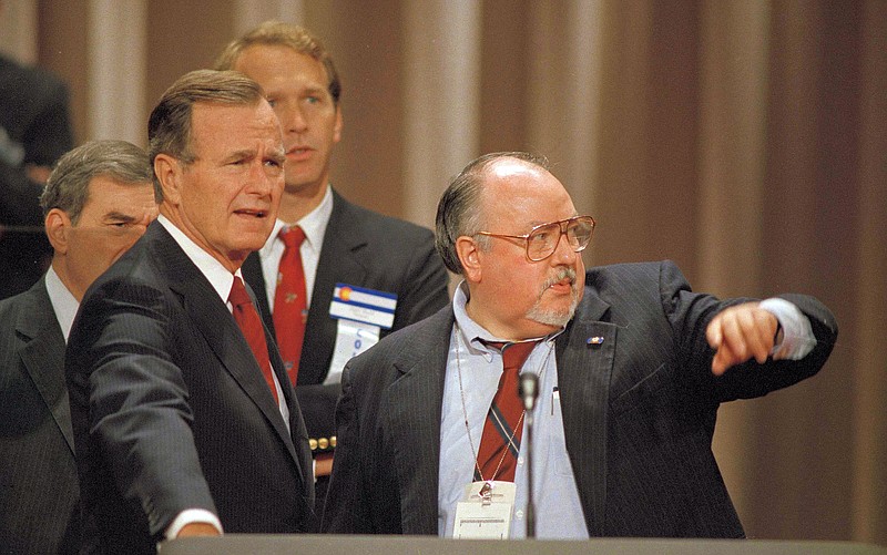 
              FILE - In this Aug. 17, 1988 file photo, Vice President George H.W. Bush, left, gets some advice from his media advisor, Roger Ailes, right, as they stand behind the podium at the Superdome in New Orleans, La., prior to the start of the Republican National Convention.  Fox News said on Thursday, May 18, 2017, that Ailes has died. He was 77. (AP Photo/Ron Edmonds)
            