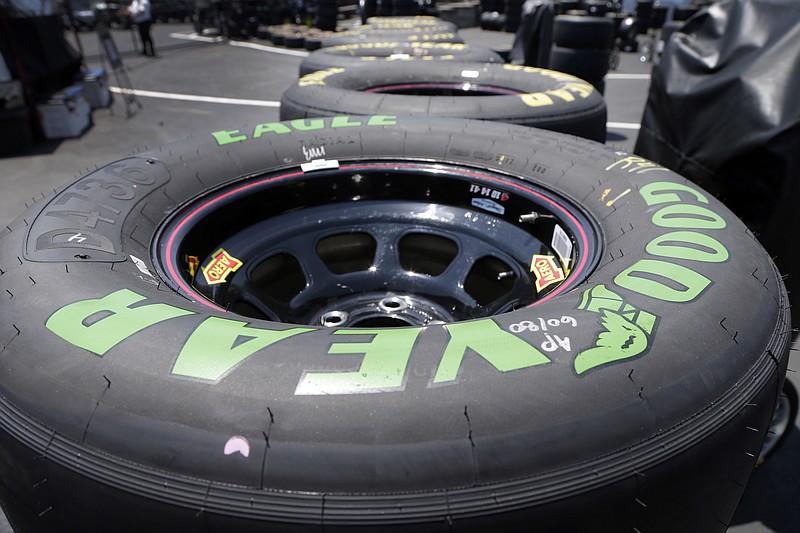 
              A green-lettered soft tire is shown with the standard tires during practice for Saturday's NASCAR Cup series All-Star auto race at Charlotte Motor Speedway in Concord, N.C., Friday, May 19, 2017. NASCAR is allowing teams to use a tire with a softer tread that will generate speeds up to a half-a-second per lap faster during the All-Star race. (AP Photo/Chuck Burton)
            