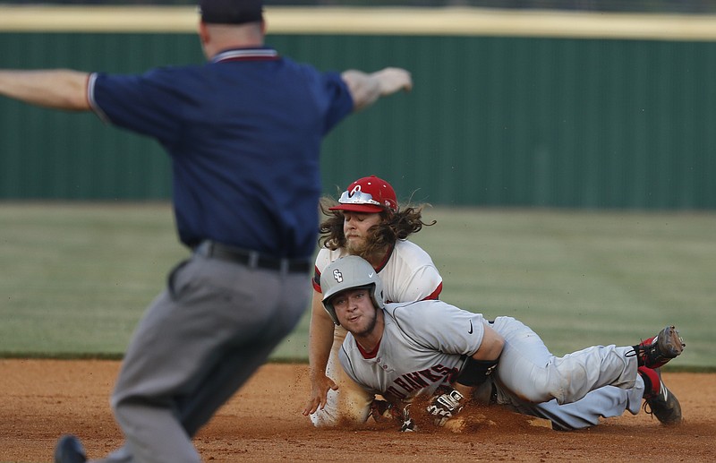 Stewarts Creek runner Jake Alexander is called safe as he slides into Ooltewah second baseman Jake Morrow during their Class AAA sectional baseball game Friday night at Ooltewah. The visiting Red Hawks won in 10 innings.