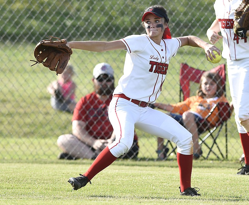 Whitwell center fielder Maddie Jordan (00) makes a throw.  The Watertown Purple Tigers visited the Whitwell Lady Tigers in a TSSAA Class A sectional softball game on May 19, 2017