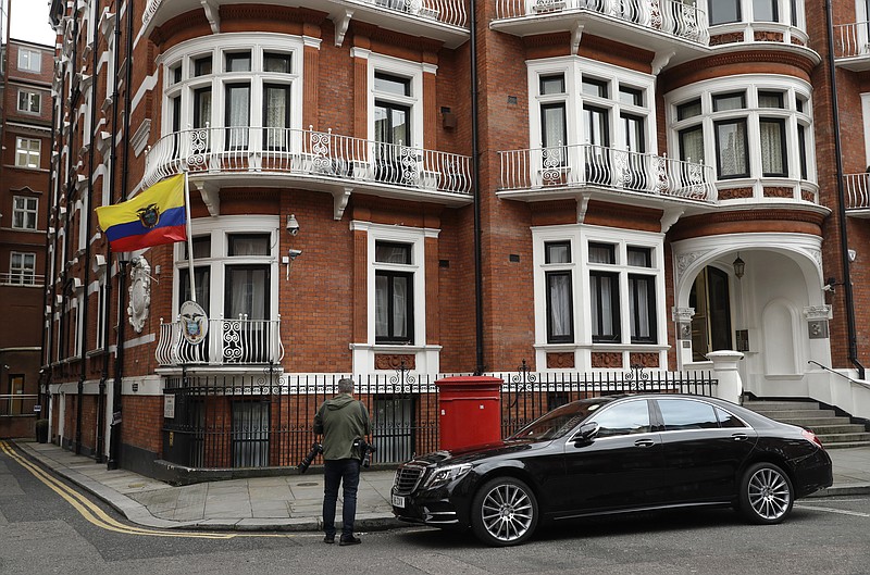 
              A photographer stands outside of the Ecuadorian embassy in London, Friday May 19, 2017. Sweden's top prosecutor says she is dropping an investigation into a rape claim against WikiLeaks founder Julian Assange after almost seven years. Assange took refuge in Ecuador's embassy in London in 2012 to escape extradition to Sweden to answer questions about sex-crime allegations from two women.  (AP Photo/Matt Dunham)
            