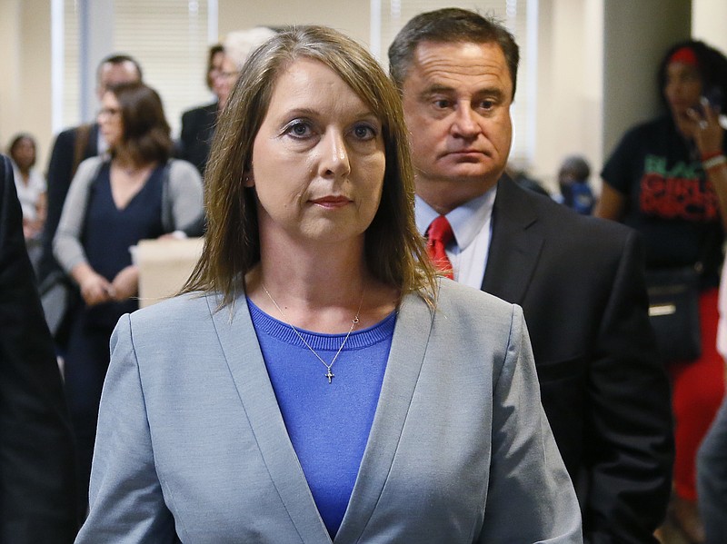 
              Betty Shelby leaves the courtroom with her husband, Dave Shelby, right, after the jury in her case began deliberations in Tulsa, Okla., Wednesday, May 17, 2017. Shelby, who fatally shot an unarmed black man last year, was found not guilty later Wednesday of first-degree manslaughter. (AP Photo/Sue Ogrocki)
            