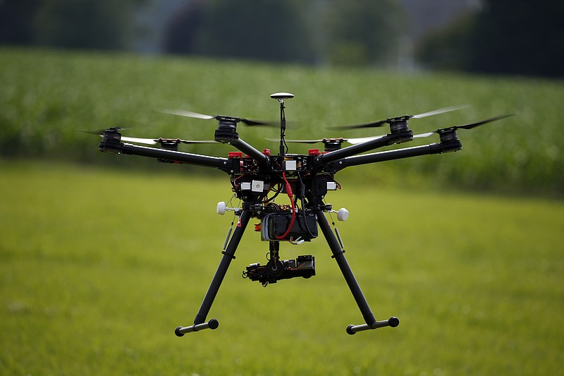 
              FILE - In this June 11, 2015, file photo, a hexacopter drone is flown during a drone demonstration in Cordova, Md. An appeals court has struck down a Federal Aviation Administration rule that required owners to register drones used for recreation.  (AP Photo/Alex Brandon, File)
            