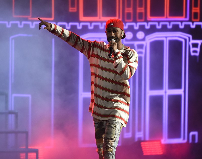 
              FILE - In this May 7, 2017, file photo, Big Sean performs "Jump Out the Window" at the MTV Movie and TV Awards at the Shrine Auditorium in Los Angeles. It was announced on May 19, 2017, that Big Sean will headline Billboard’s Hot 100 Music Festival on New York’s Jones Beach. The two-day concert begins Aug. 19. (Photo by Chris Pizzello/Invision/AP, File)
            