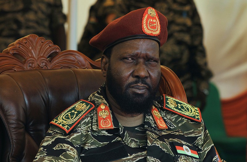 
              South Sudan's President Salva Kiir attends a ceremony marking the 34th anniversary of the Sudan People's Liberation Army (SPLA) in the capital Juba, South Sudan Thursday, May 18, 2017. South Sudan's civil war has killed tens of thousands and driven out more than 1.5 million people in the past three years, creating the world's largest refugee crisis. (AP Photo/Bullen Chol)
            