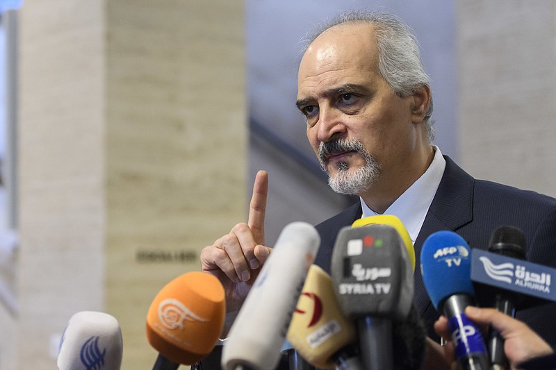 
              Bashar al-Ja'afari, Syrian chief negotiator and Ambassador of the Permanent Representative Mission of the Syria to UN New York, briefs the media during a press conference after a round of negotiations with UN Special Envoy for Syria Staffan de Mistura at the European headquarters of the United Nations in Geneva, Switzerland, Friday, May 19, 2017. (Martial Trezzini/Keystone via AP)
            