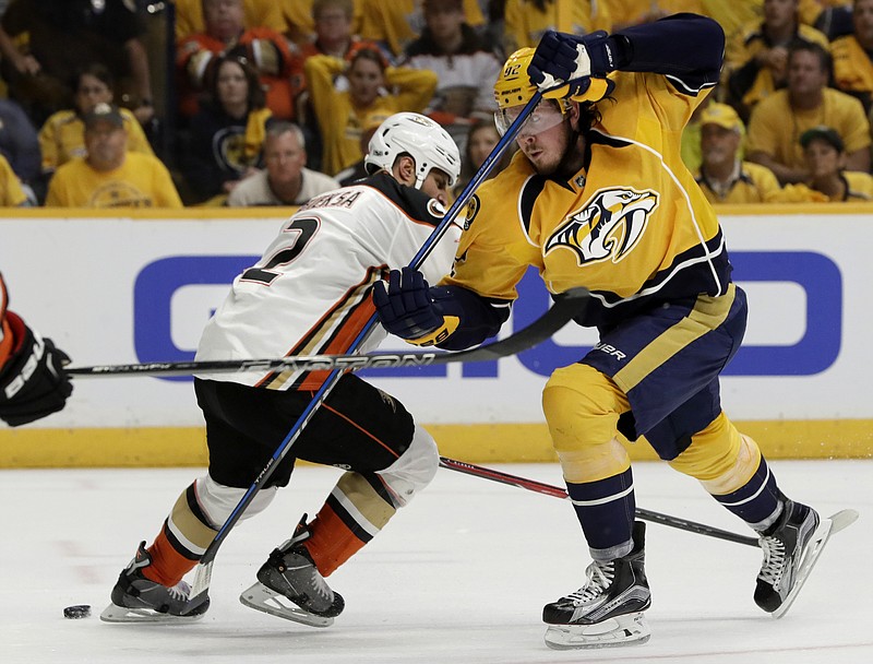 Anaheim Ducks defenseman Kevin Bieksa (2) battles against Nashville Predators center Ryan Johansen (92) in the second period of Game 4 of the Western Conference final in the NHL hockey Stanley Cup playoffs Thursday, May 18, 2017, in Nashville, Tenn. (AP Photo/Mark Humphrey)