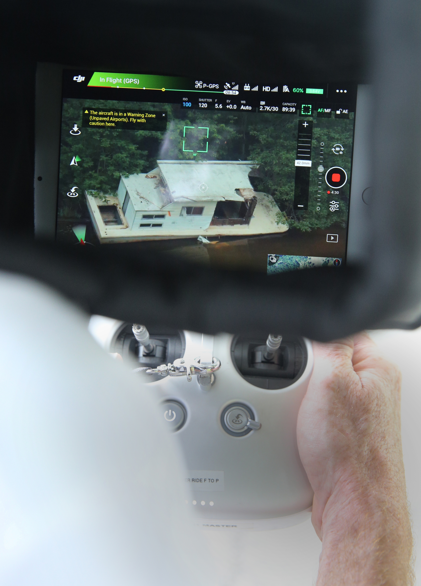 Video is displayed on a screen connected to a controller as Hamilton County Sheriff's Office Detective Marty Dunn flies an unmanned aerial surveillance system Friday, May 19, 2017, at Chester Frost Park in Hixson, Tenn. The cost to fly manned aviation in public safety is estimated around $350 per hour, while using unmanned aerial surveillance systems, or drones, to support operations are estimated to cost just below $25 per hour.