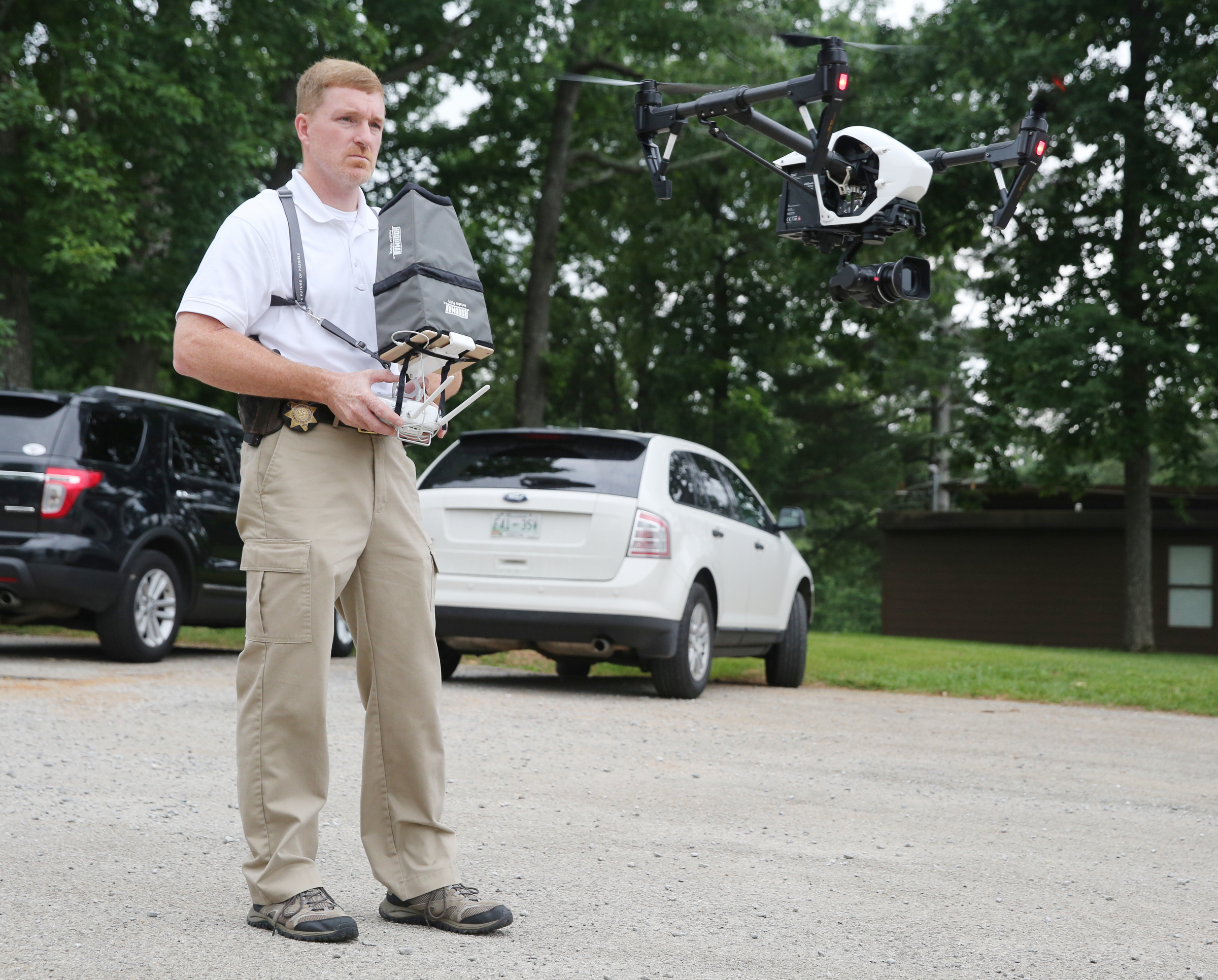 Hamilton County Sheriff's Office Detective Marty Dunn flies an unmanned aerial surveillance system Friday, May 19, 2017, at Chester Frost Park in Hixson, Tenn. Unmanned aerial surveillance systems, or drones, allow law enforcement a viable, safe, and economic means of collecting information about dangerous or potentially dangerous situations.
