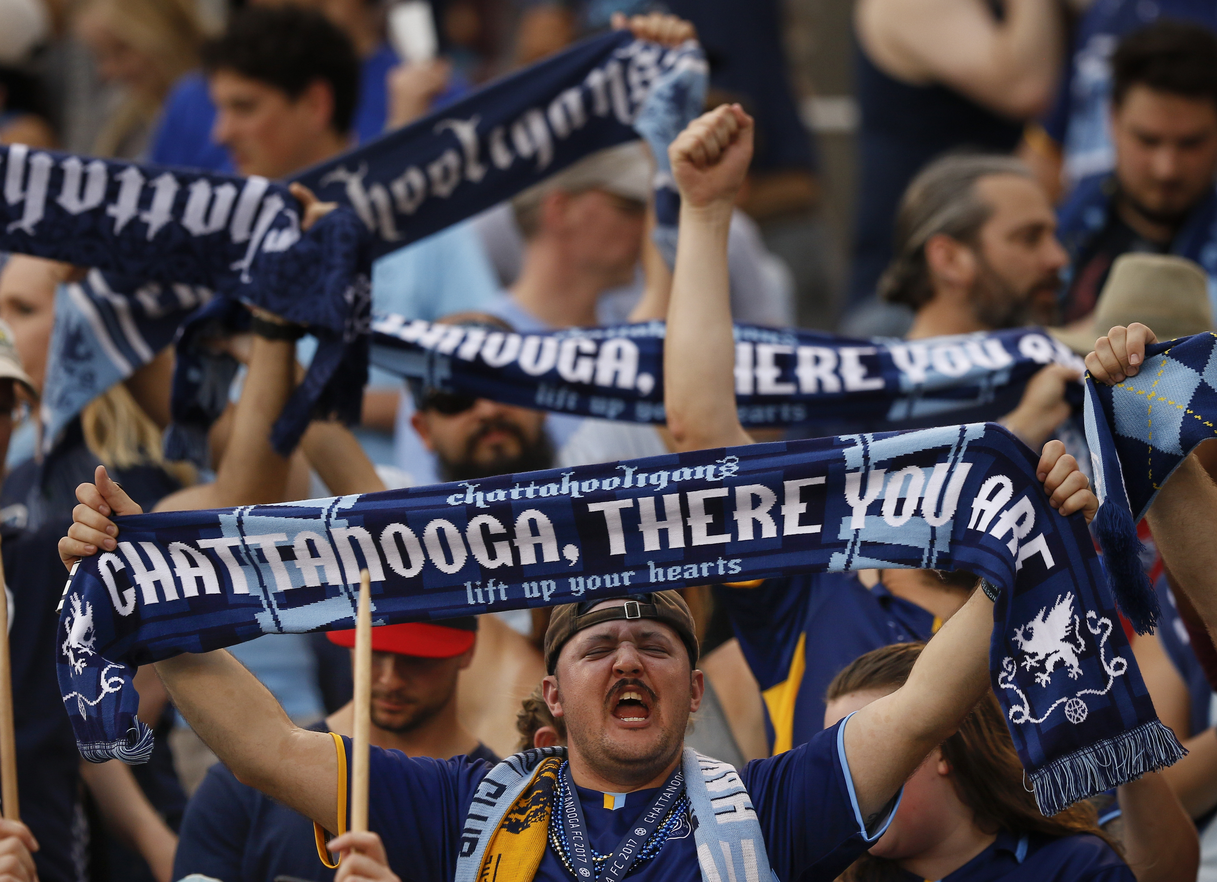Chattahooligans cheer during Chattanooga FC's home opener against the Birmingham Hammers at Finley Stadium on Saturday, May 20, 2017, in Chattanooga, Tenn.