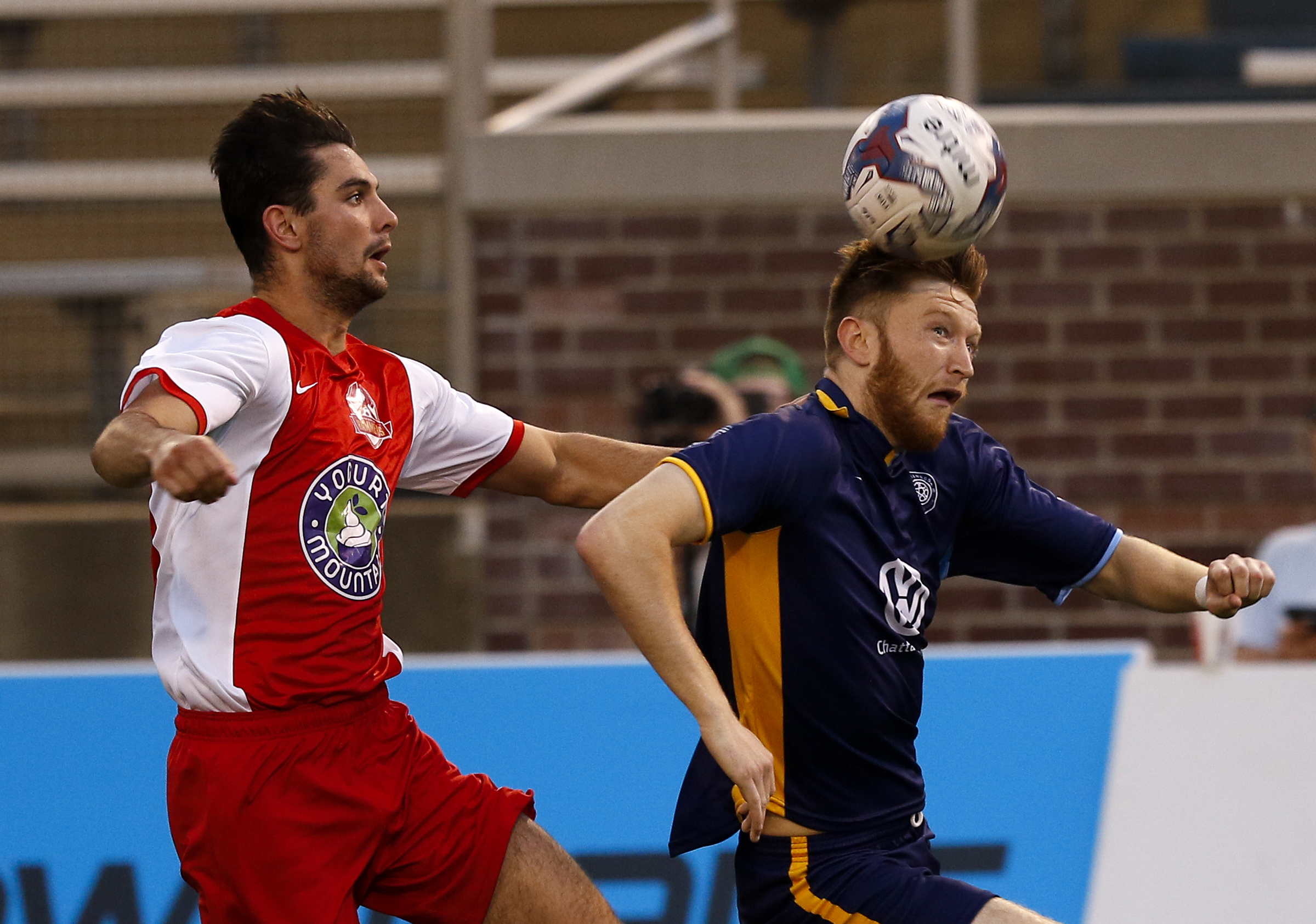 CFC's Carl Reynolds heads the ball ahead of Birmingham's Jack Ball during Chattanooga FC's home opener against the Birmingham Hammers at Finley Stadium on Saturday, May 20, 2017, in Chattanooga, Tenn.