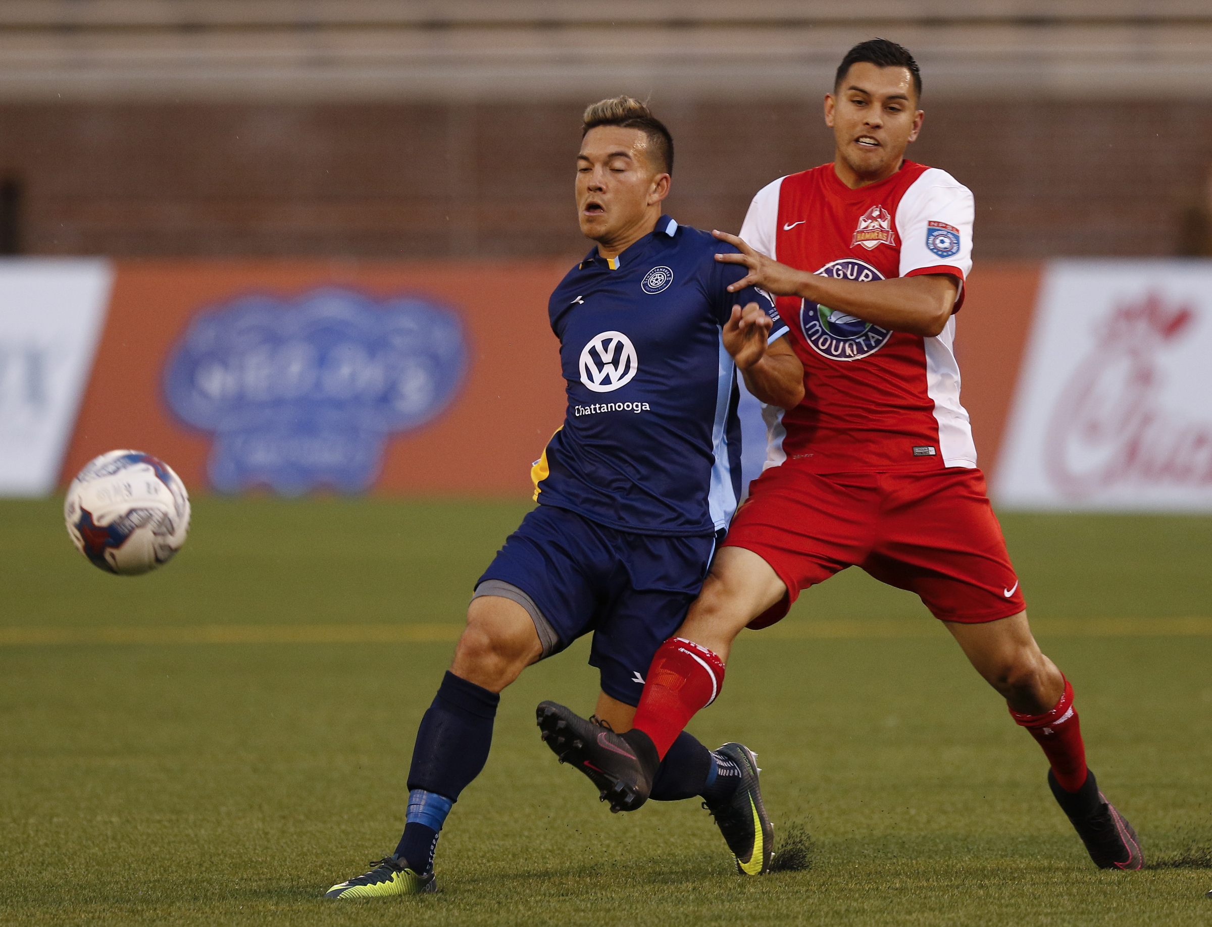 CFC's John Carrier, left, keeps the ball out ahead of Birmingham's Jack Ball during Chattanooga FC's home opener against the Birmingham Hammers at Finley Stadium on Saturday, May 20, 2017, in Chattanooga, Tenn.