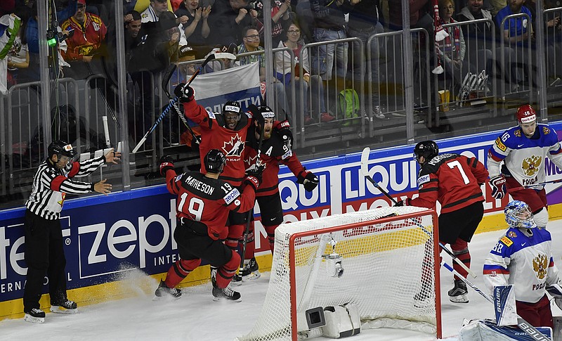 
              Canada's Ryan O'Reilly, center, reacts after scoring team's third goal against Russia with teammates during the Ice Hockey World Championships semifinal match between Canada and Russia in the LANXESS arena in Cologne, Germany, Saturday, May 20, 2017. (AP Photo/Martin Meissner)
            