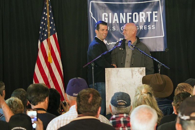 
              FILE-  In this May 11, 2017 file photo, Republican Greg Gianforte, right, welcomes Donald Trump Jr., the president's son, onto the stage at a rally in East Helena, Mont. Gianforte, a businessman, kept Trump at arm’s length when he unsuccessfully ran for Montana governor on the GOP ticket last year. Now he’s wholeheartedly embracing his party’s president in his race for the state’s open congressional seat. (AP Photo/Bobby Caina Calvan, File)
            