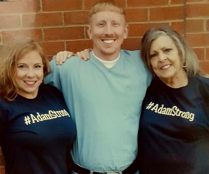 From left, Christina Braseel, Adam Braseel and Imojean Braseel-Davis embrace during a recent visit at the Bledsoe County Correctional Complex, west of Pikeville, Tenn.