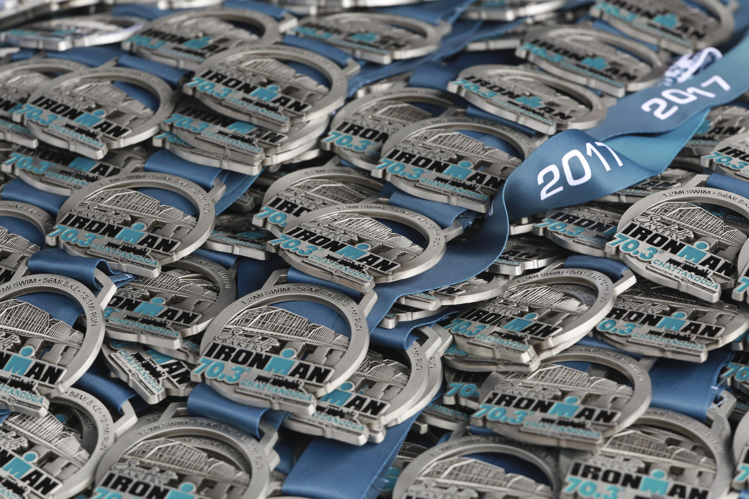 Medals are lined up for finishers during Sunbelt Bakery IRONMAN 70.3 Chattanooga triathlon presented by McKee A Family Bakery in downtown Chattanooga on Sunday, May 21, 2017. Photo by Dan Henry | DanHenryPhotography.com