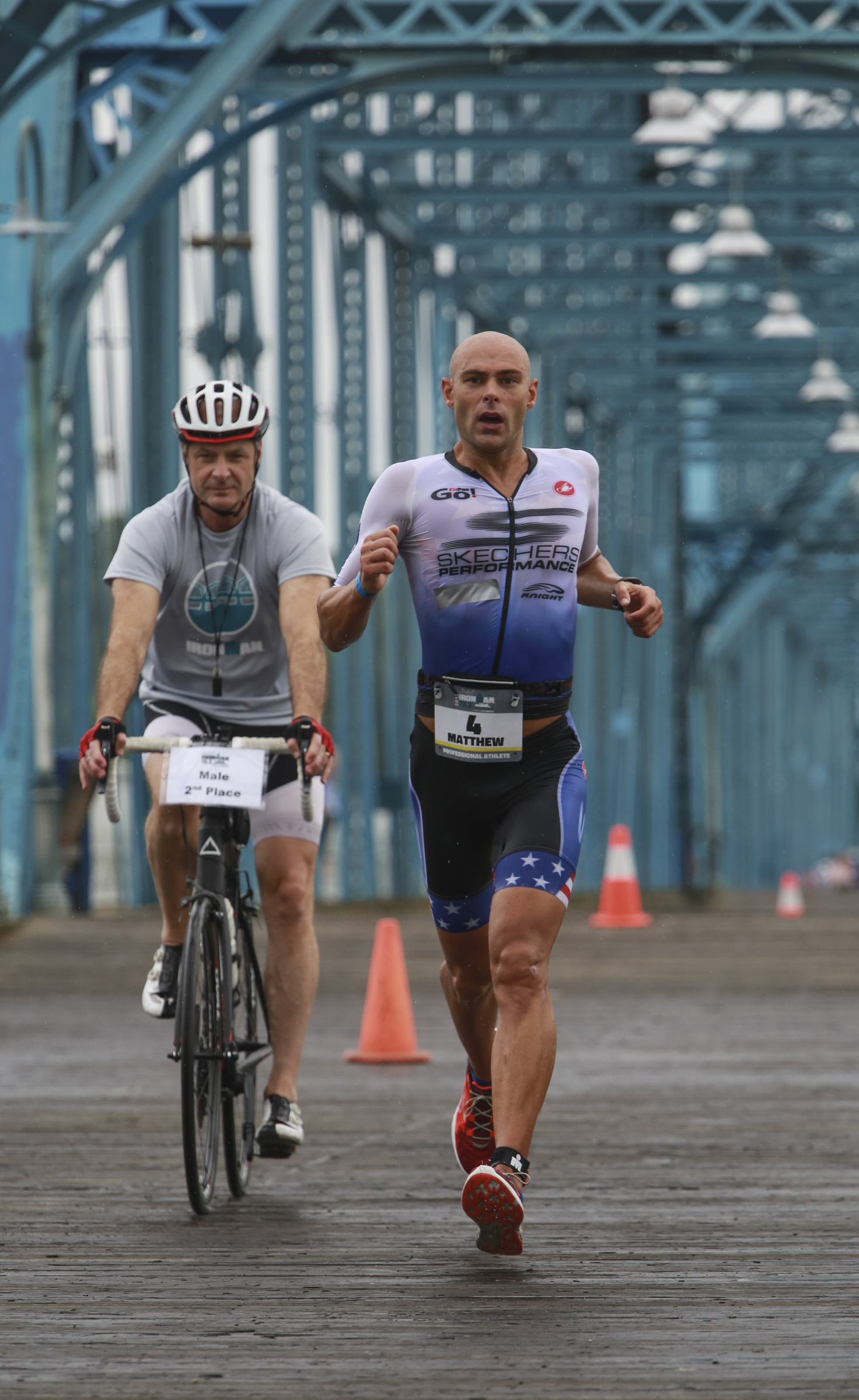 Matthew Russell chases down the lead runner before winning the 2017 Sunbelt Bakery IRONMAN 70.3 Chattanooga triathlon presented by McKee A Family Bakery in downtown Chattanooga on Sunday, May 21, 2017. Photo by Dan Henry | DanHenryPhotography.com