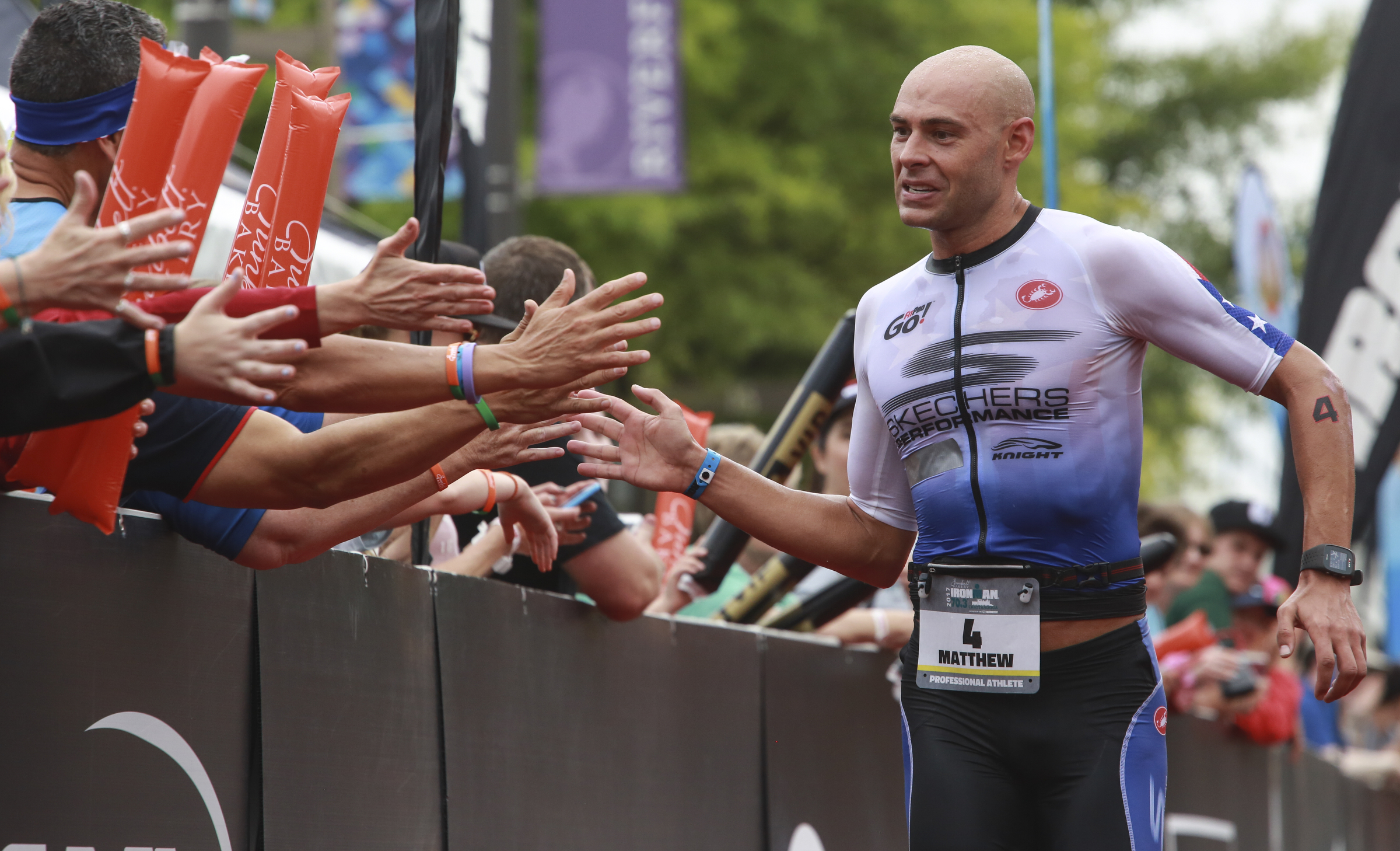 Matthew Russell makes his way through the chute to win the 2017 Sunbelt Bakery IRONMAN 70.3 Chattanooga triathlon presented by McKee A Family Bakery in downtown Chattanooga on Sunday, May 21, 2017. Photo by Dan Henry | DanHenryPhotography.com