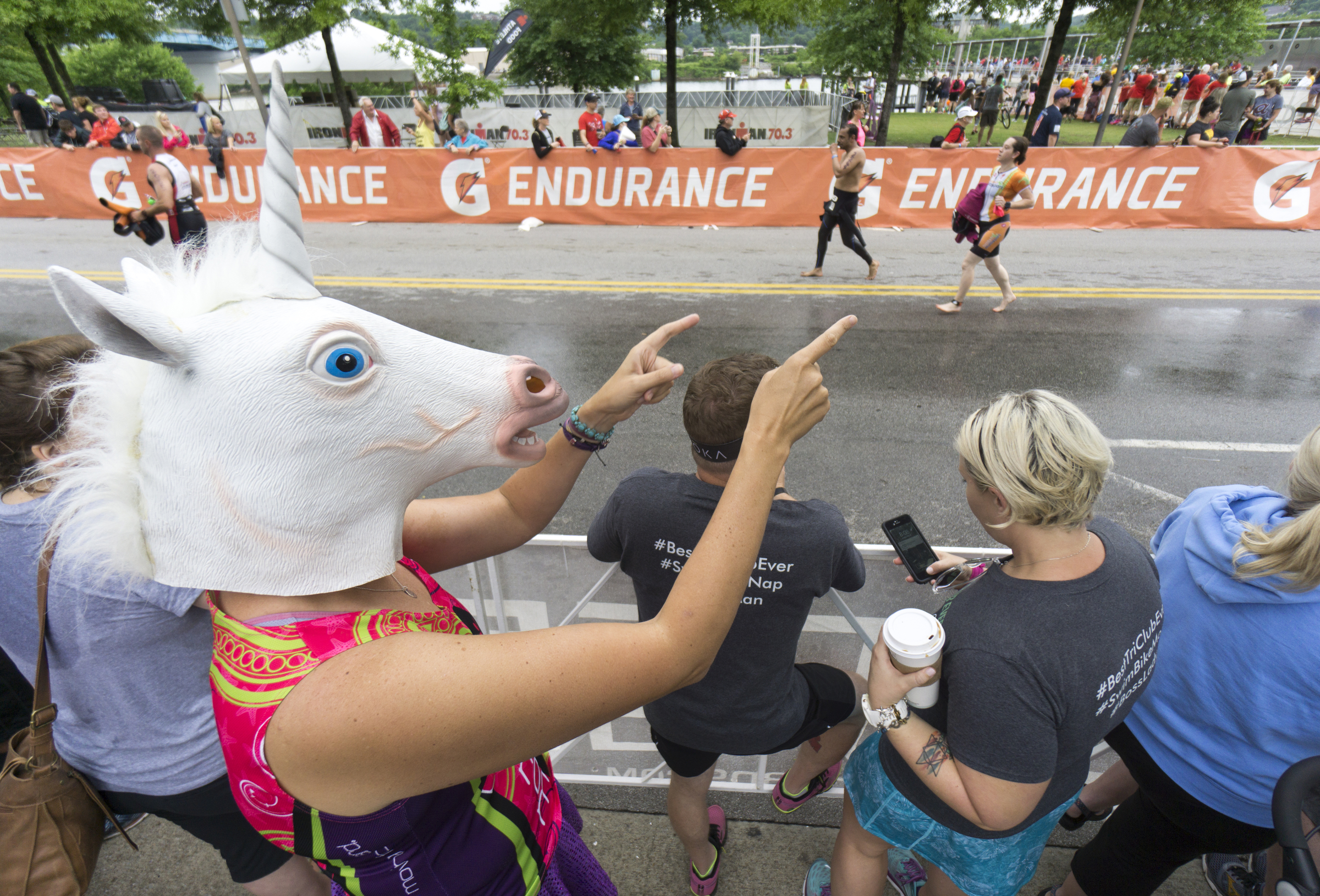 Anne Reed from Florida motivates age group athletes as they compete in the Sunbelt Bakery IRONMAN 70.3 Chattanooga triathlon presented by McKee A Family Bakery in downtown Chattanooga on Sunday, May 21, 2017. Photo by Dan Henry | DanHenryPhotography.com