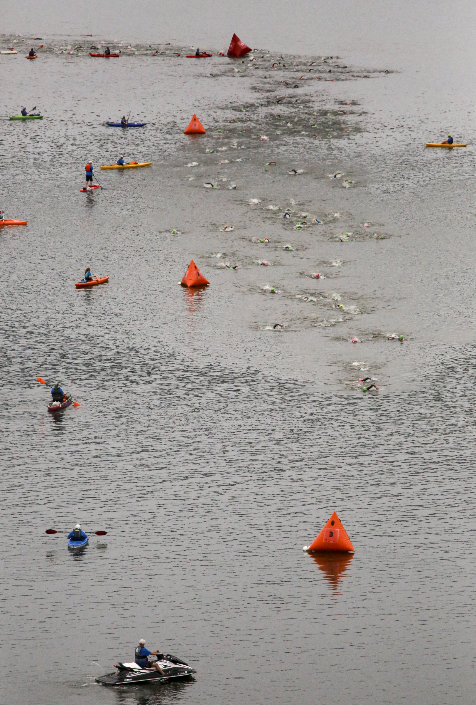 Age group athletes participate in the swim portion of the race during the Sunbelt Bakery IRONMAN 70.3 Chattanooga triathlon presented by McKee A Family Bakery in downtown Chattanooga on Sunday, May 21, 2017. Photo by Dan Henry | DanHenryPhotography.com