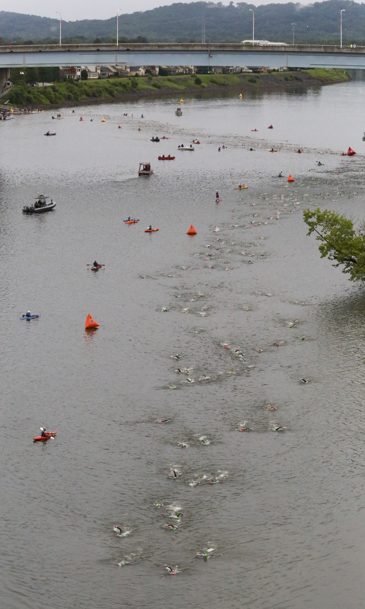 Age group athletes participate in the swim portion of the race during the Sunbelt Bakery IRONMAN 70.3 Chattanooga triathlon presented by McKee A Family Bakery in downtown Chattanooga on Sunday, May 21, 2017. Photo by Dan Henry | DanHenryPhotography.com