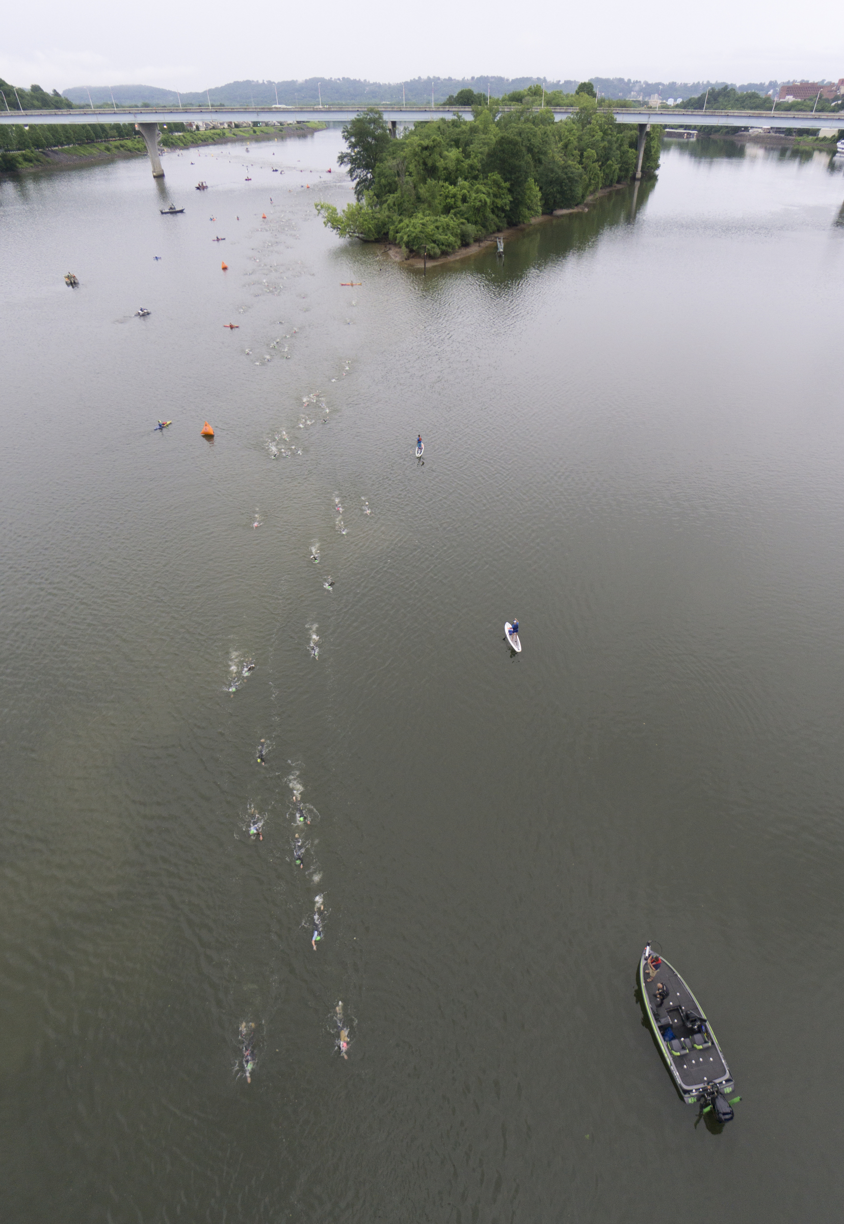 Age group athletes participate in the swim portion of the race during the Sunbelt Bakery IRONMAN 70.3 Chattanooga triathlon presented by McKee A Family Bakery in downtown Chattanooga on Sunday, May 21, 2017. Photo by Dan Henry | DanHenryPhotography.com