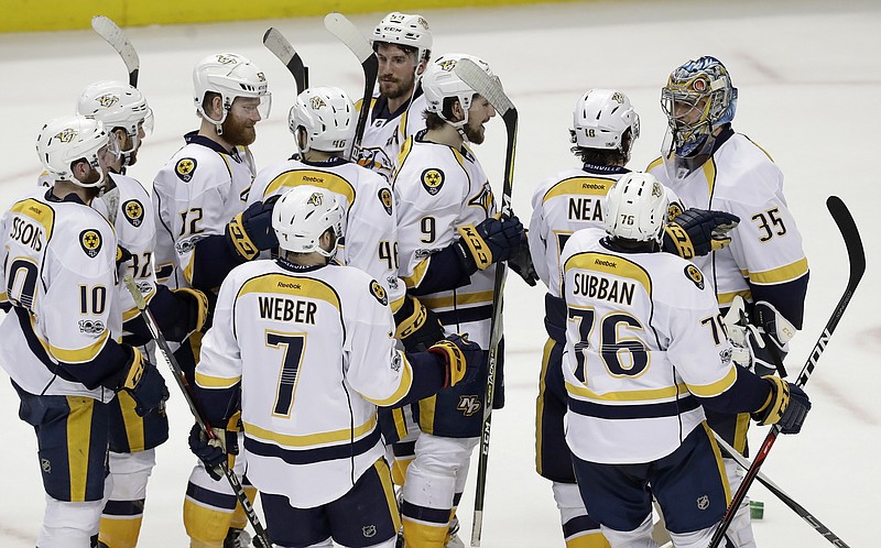 
              Teammates celebrate with Nashville Predators goalie Pekka Rinne (35) after defeating the Anaheim Ducks in Game 5 in the NHL hockey Stanley Cup Western Conference finals in Anaheim, Calif., Saturday, May 20, 2017. (AP Photo/Chris Carlson)
            