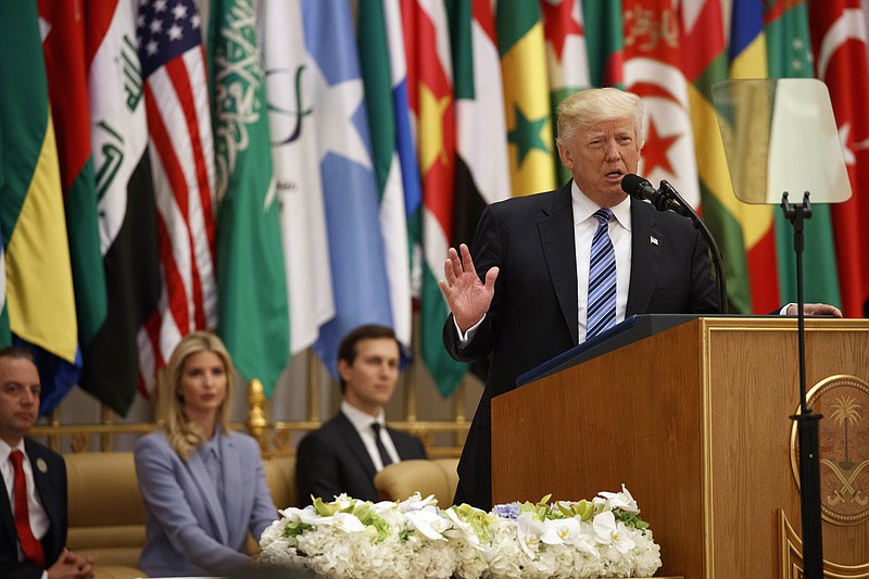
              President Donald Trump delivers a speech to the Arab Islamic American Summit, at the King Abdulaziz Conference Center, Sunday, May 21, 2017, in Riyadh, Saudi Arabia. From left, White House Chief of Staff Reince Priebus, Ivanka Trump, White House senior adviser Jared Kushner. (AP Photo/Evan Vucci)
            