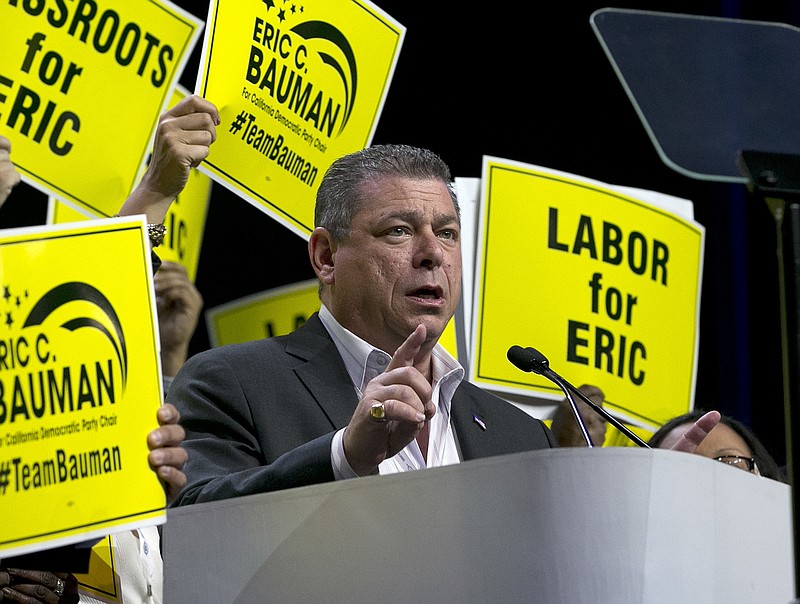 
              Eric Bauman, who is running to head the California Democratic Party, addresses the California Democratic Party annual convention Saturday, May 20, 2017, in Sacramento, Calif. Bauman is running against Kimberly Ellis to succeed current party chairman John Burton. (AP Photo/Rich Pedroncelli)
            