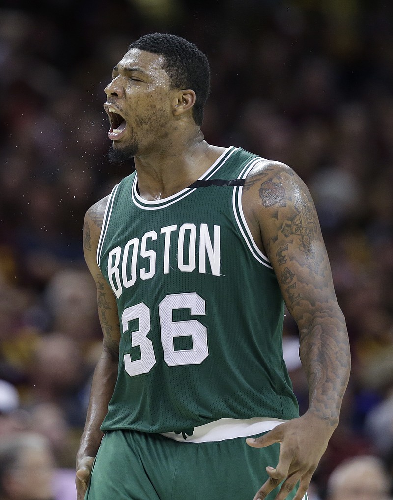 
              Boston Celtics' Marcus Smart (36) reacts after hitting a three point basket against the Cleveland Cavaliers during the second half of Game 3 of the NBA basketball Eastern Conference finals, Sunday, May 21, 2017, in Cleveland. (AP Photo/Tony Dejak)
            