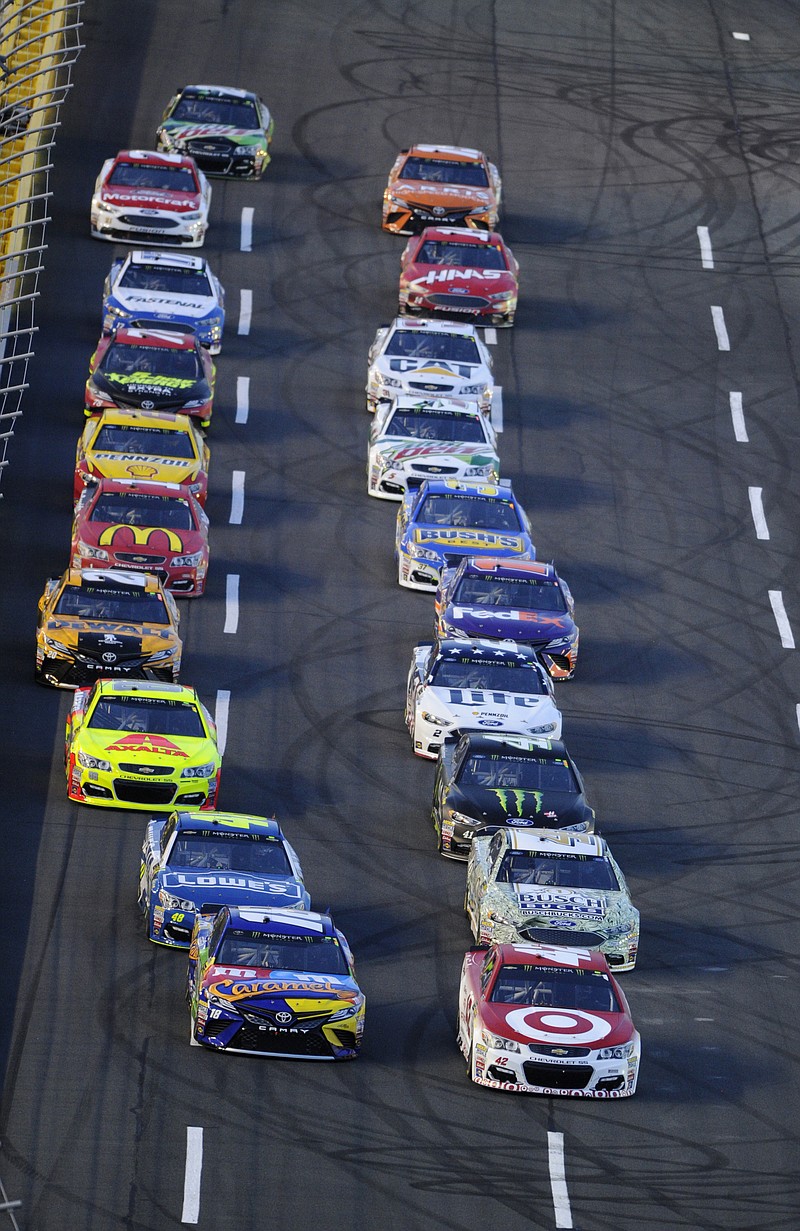 
              Kyle Larson, front right, and Kyle Busch, from left, lead the field at the start of the NASCAR All-Star auto race at the Charlotte Motor Speedway in Concord, N.C., Saturday, May 20, 2017. (AP Photo/Mike McCarn)
            