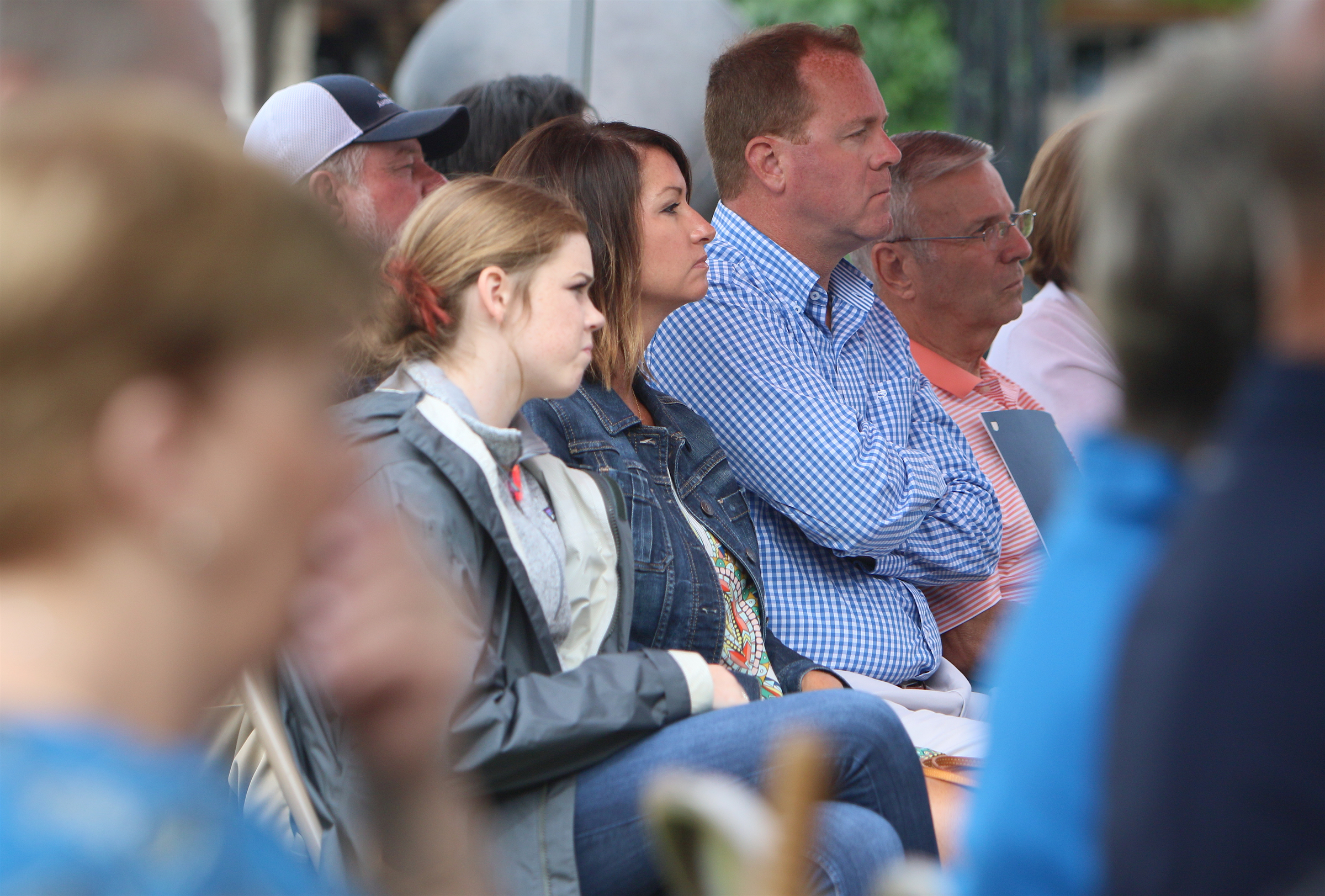 Ashlynn Bechard, Wendy Bechard, Steven Bechard and Steve Bechard listen to speakers during the Veterans Bridge Flag Raising Ceremony held to honor service men and women Mon., May 22, 2017, at the Bluff View Art District Sculpture Garden in Chattanooga, Tenn. Honorees, including Steve Bechard, received a proclamation recognizing their service to the country and announcing the pole number from which their flag flies.