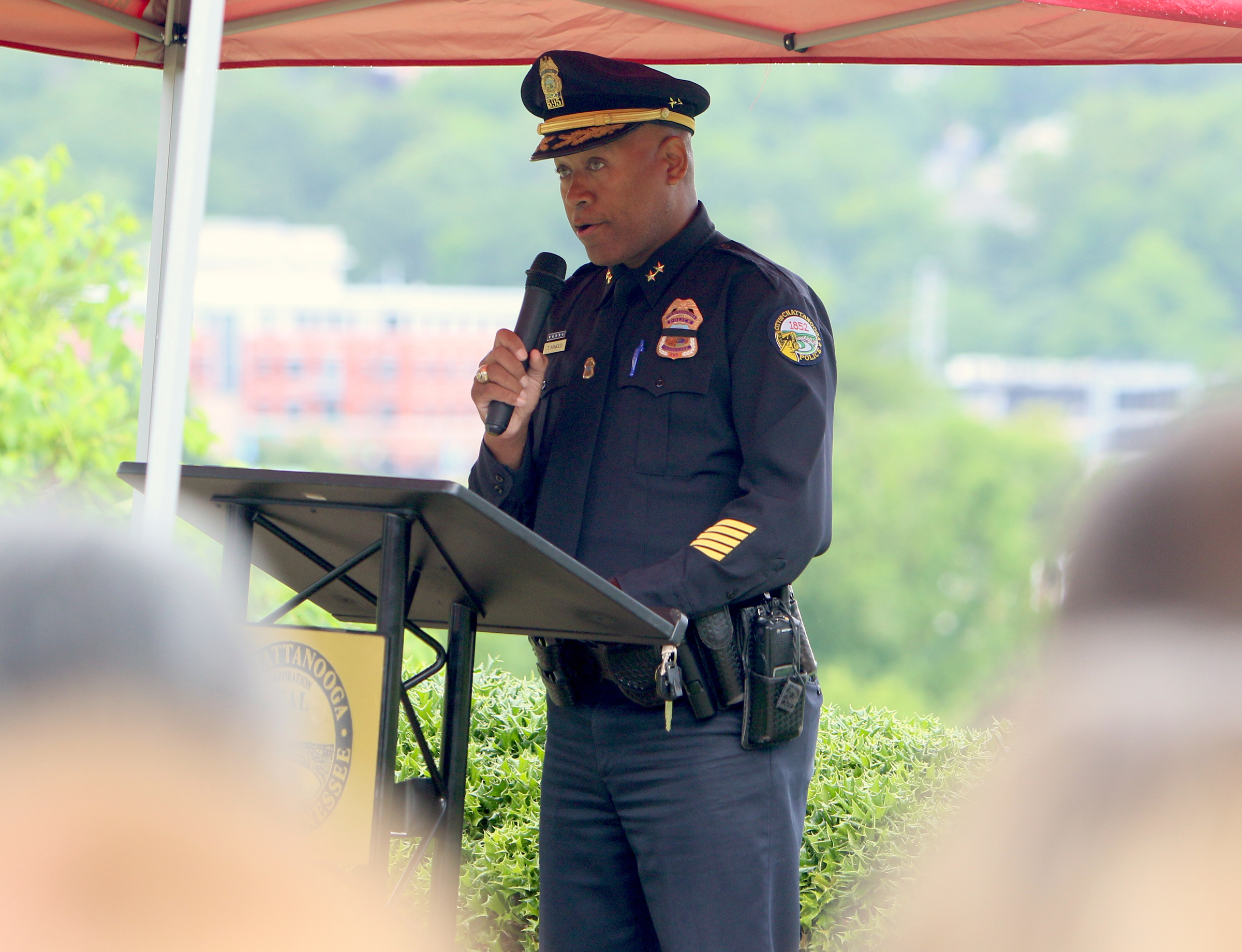 Tracy Arnold with the Chattanooga Police Department says a few words to open the Veterans Bridge Flag Raising Ceremony held to honor service men and women Mon., May 22, 2017, at the Bluff View Art District Sculpture Garden in Chattanooga, Tenn. The City of Chattanooga launched the Veterans Bridge Flag Initiative in May of 2014 to ensure those who served for the United States would continue to be honored through American flags flying on Veterans Bridge.