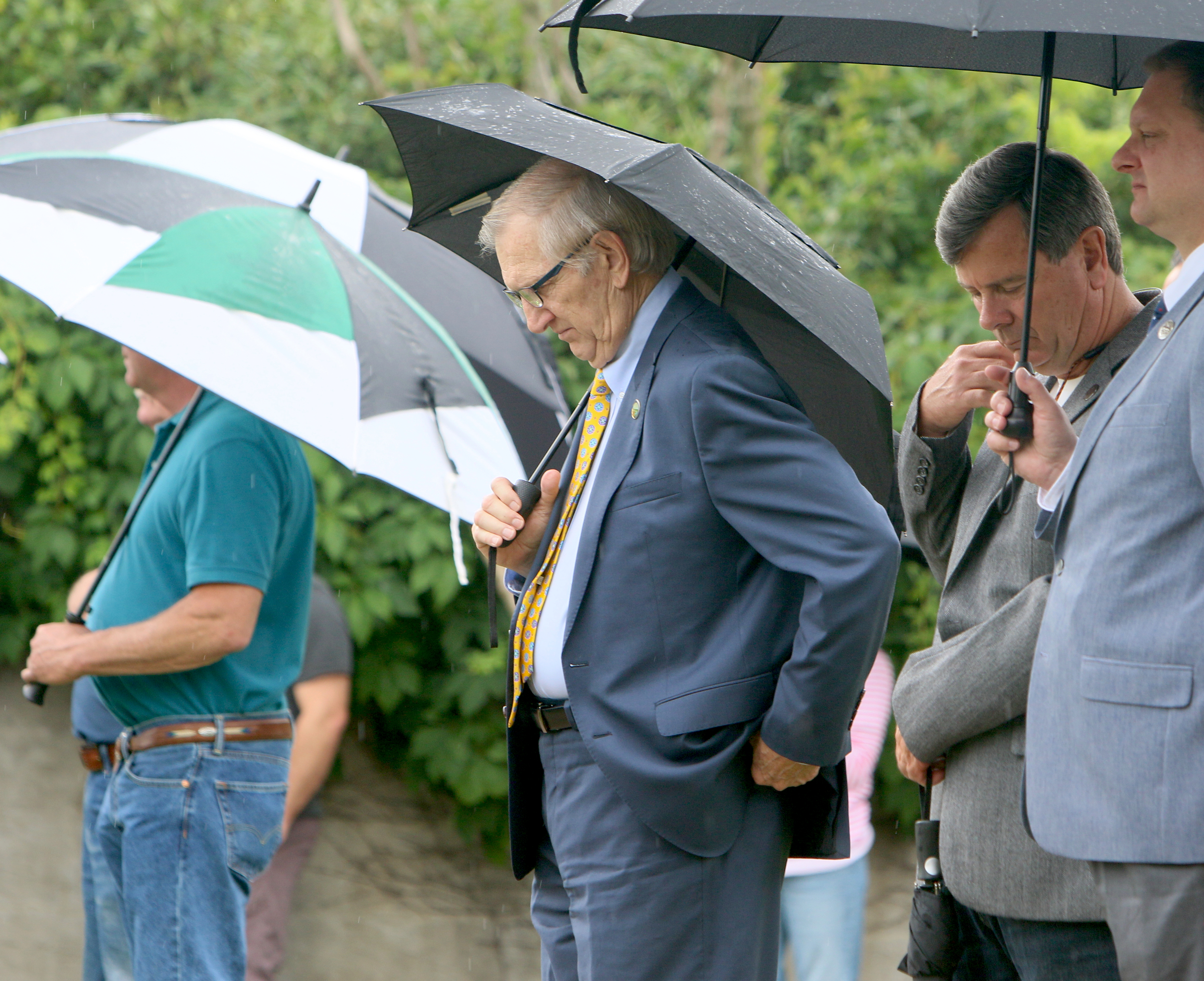 Despite the rain, Judge Russell Bean and a crowd of others attend the Veterans Bridge Flag Raising Ceremony held to honor service men and women Mon., May 22, 2017, at the Bluff View Art District Sculpture Garden in Chattanooga, Tenn. The City of Chattanooga launched the Veterans Bridge Flag Initiative in May of 2014 to ensure those who served for the United States would continue to be honored through American flags flying on Veterans Bridge.