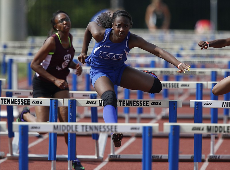 Chattanooga School for the Arts and Sciences Lennex Walker pulls ahead to win the 2016 TSSAA Track and Field Tennessee State Championships 100-meter hurdle event at MTSU in Murfreesboro, Tenn., on May 26, 2016. 