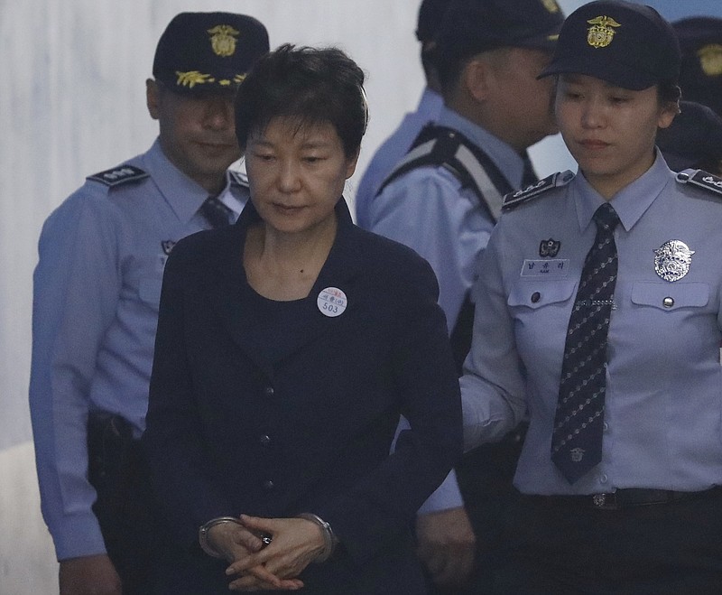 
              Former South Korean President Park Geun-hye, center, arrives at a court in Seoul, South Korea Tuesday, May 23, 2017 for the beginning of her corruption trial. (Kim Hong-ji/Pool Photo via AP)
            