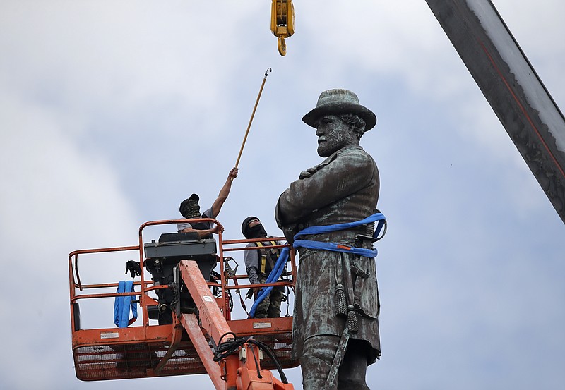 
              FILE- In this Friday, May 19, 2017, file photo, workers prepare to take down the statue of former Confederate general Robert E. Lee, which stands over 100 feet tall, in Lee Circle in New Orleans. Mississippi Rep. Karl Oliver of Winona apologized on Monday, May 22, for saying Louisiana leaders should be lynched for removing Confederate monuments, only after his comment sparked broad condemnation in both states. The post was made after three Confederate monuments and a monument to white supremacy were removed in New Orleans. (AP Photo/Gerald Herbert, File)
            