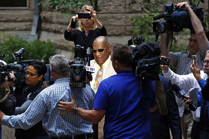 
              Bill Cosby, center, arrives for jury selection in his sexual assault case at the Allegheny County Courthouse, Monday, May 22, 2017, in Pittsburgh. The case is set for trial June 5 in suburban Philadelphia. (AP Photo/Gene J. Puskar)
            