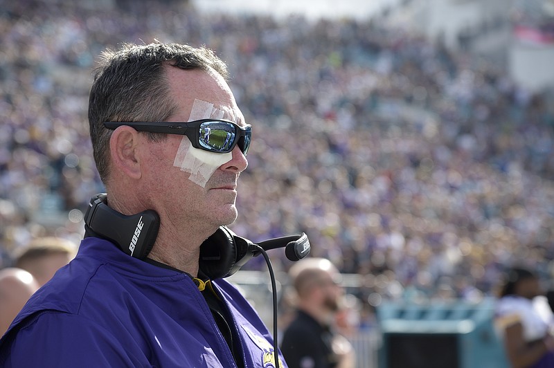 
              FILE - In this Dec. 11, 2016, file photo, Minnesota Vikings head coach Mike Zimmer stands for the singing of the national anthem prior to an NFL football game against the Jacksonville Jaguars, in Jacksonville, Fla. Zimmer will be taking some time away from the team to recover from multiple eye surgeries. The Vikings say Zimmer is expected to return “in a few weeks.”
Zimmer has undergone eight surgeries on his right eye, where he suffered a detached retina, since Nov. 1. (AP Photo/Phelan M. Ebenhack)
            