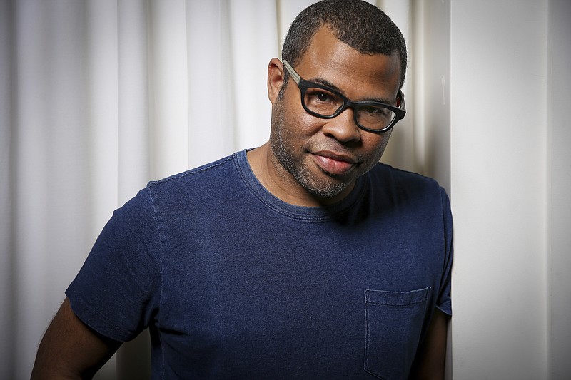 
              FILE - In this Feb. 9, 2017 file photo, director Jordan Peele poses for a portrait at the SLS Hotel in Los Angeles to promote his film, "Get Out". Peele is following up the remarkable success of “Get Out” with a provocative original thriller set for release in March 2019. Universal Pictures announced the release date for Peele’s untitled film on Monday, May 22. (Photo by Rich Fury/Invision/AP, File)
            