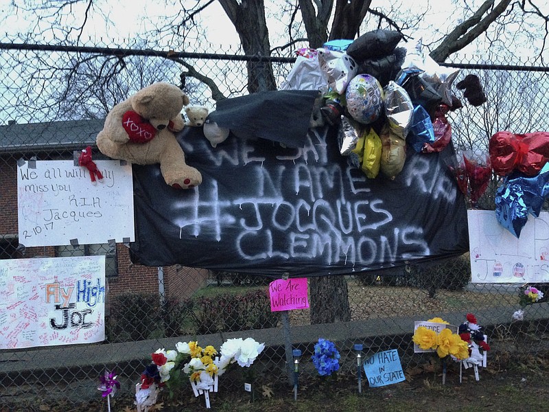 FILE - This Feb. 14, 2017, file photo shows a memorial set up in a neighborhood near where Nashville Officer Josh Lippert shot Jocques Clemmons in Nashville, Tenn. Lippert, a white Tennessee police officer who shot a black man to death during a pursuit, was cleared of charges based largely on the testimony of a witness. (AP Photo/Jonathan Mattise, File)