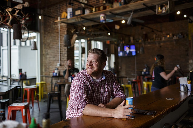A.J. Walker drinks a beer at the new Jack Brown's Beer and Burger Joint in the Tomorrow Building, formerly the Yesterday's building, on Tuesday, May 23, 2017, in Chattanooga, Tenn.