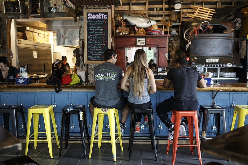 Guests dine at the new Jack Brown's Beer and Burger Joint in the Tomorrow Building, formerly the Yesterday's building, on Tuesday, May 23, 2017, in Chattanooga, Tenn.