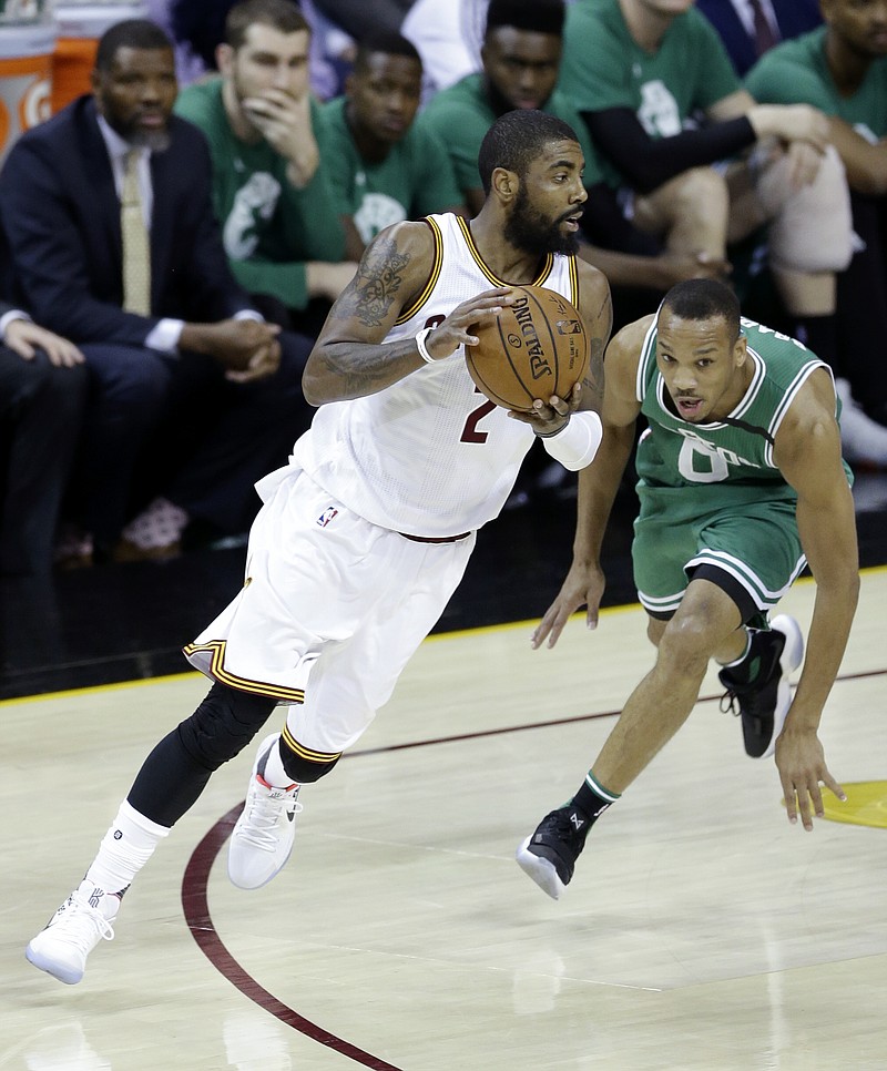 
              Cleveland Cavaliers' Kyrie Irving (2) drives against Boston Celtics' Avery Bradley (0) during the first half of Game 4 of the NBA basketball Eastern Conference finals, Tuesday, May 23, 2017, in Cleveland. (AP Photo/Tony Dejak)
            