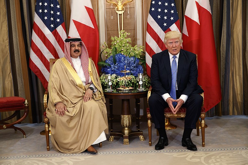 
              FILE -- In this Sunday, May 21, 2017 file photo, U.S. President Donald Trump, right, meets with Bahrain's King Hamad bin Isa Al Khalifa in Riyadh, Saudi Arabia. Trump's administration had approved a multibillion-dollar sale of F-16 fighter jets to Bahrain without the human rights conditions imposed by the State Department under President Barack Obama. On Tuesday May 23, 2017, Bahrain police raided a town where a sit-in has been going on for months supporting a prominent Shiite cleric who had his citizenship stripped by the government. Activists and rights group warn Trump's embrace of Bahrain only will fuel the crackdown. (AP Photo/Evan Vucci, File)
            