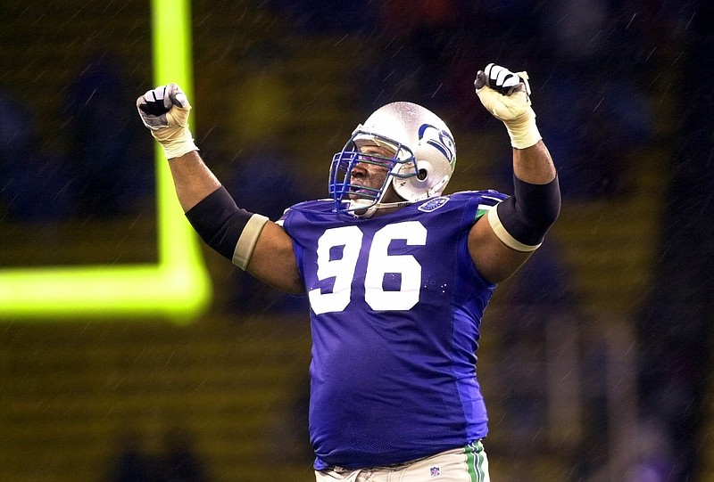 
              FILE - In this Dec. 16, 2000, file photo, Seattle Seahawks defensive tackle Cortez Kennedy (96) celebrates Seattle's 27-24 victory over the Oakland Raiders in an NFL football game in Seattle. The Orlando Police Department confirmed that Kennedy was found dead Tuesday, May 23, 2017, in Orlando. (AP Photo/Cheryl Hatch, File)
            