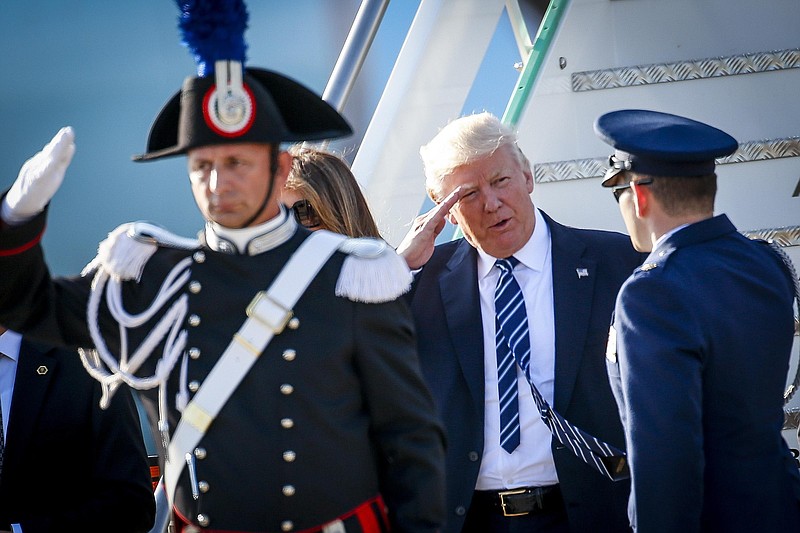 
              US President Donald Trump and his wife Melania arrive at Fiumicino's Leonardo Da Vinci International airport, near Rome, Tuesday, May 23, 2017. Trump is in Italy for a two day visit, including a meeting with Pope Francis at the Vatican, ahead of his participation in a NATO meeting in Brussels on Thursday. (Riccardo Antimiani/ANSA via AP)
            