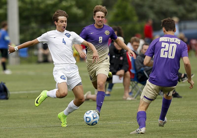 McCallie's Benjamin Brock (4) makes a run on the goal around Christian Brothers' Conner Defreece (8) and Mark Zimmerman (20) during their TSSAA Division II state soccer semifinal match against Christian Brothers on Wednesday, May 24, 2017, in Murfreesboro, Tenn. McCallie won 1-0 to advance to the state final.