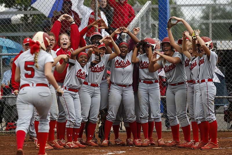 The Ooltewah softball team waits at home for teammate Mabry Carpenter (5) after her 3-run homer during their TSSAA Class AAA state girls softball quarterfinal against Gibbs on Wednesday, May 24, 2017, in Murfreesboro, Tenn.